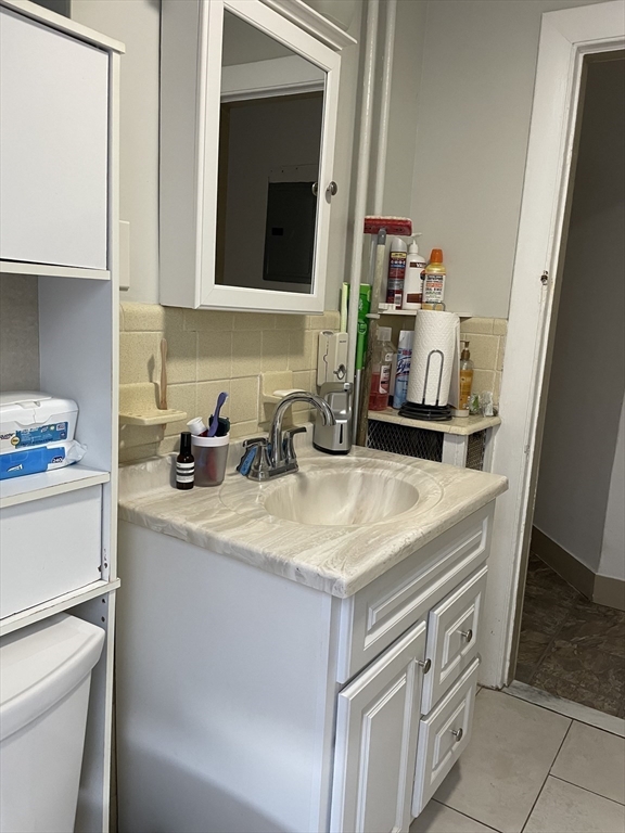 88 Alexander Street Boston, MA 02125 - Photo 11 of 17 a bathroom with a sink and a mirror