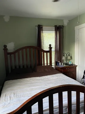 a room with a table chairs and wooden floor