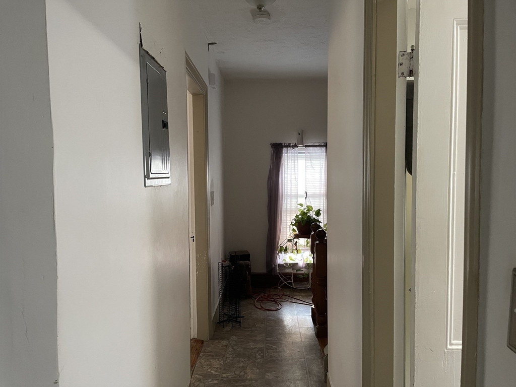 88 Alexander Street Boston, MA 02125 - Photo 16 of 17 a view of a hallway with a livingroom and a dinning room