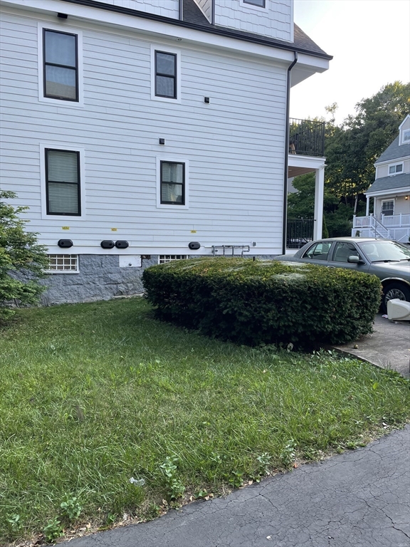 88 Alexander Street Boston, MA 02125 - Photo 4 of 17 a view front of house with backyard and garden