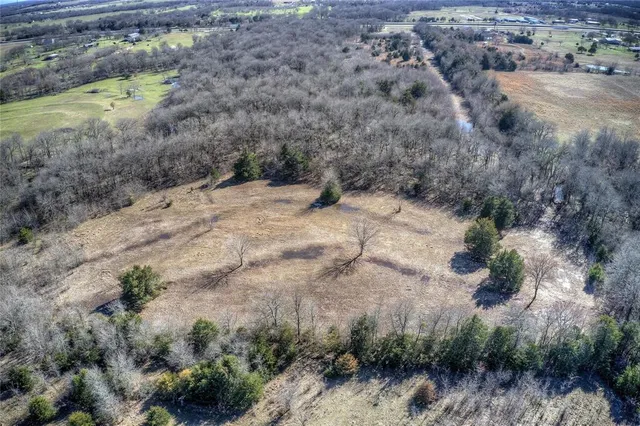 an aerial view of house with yard