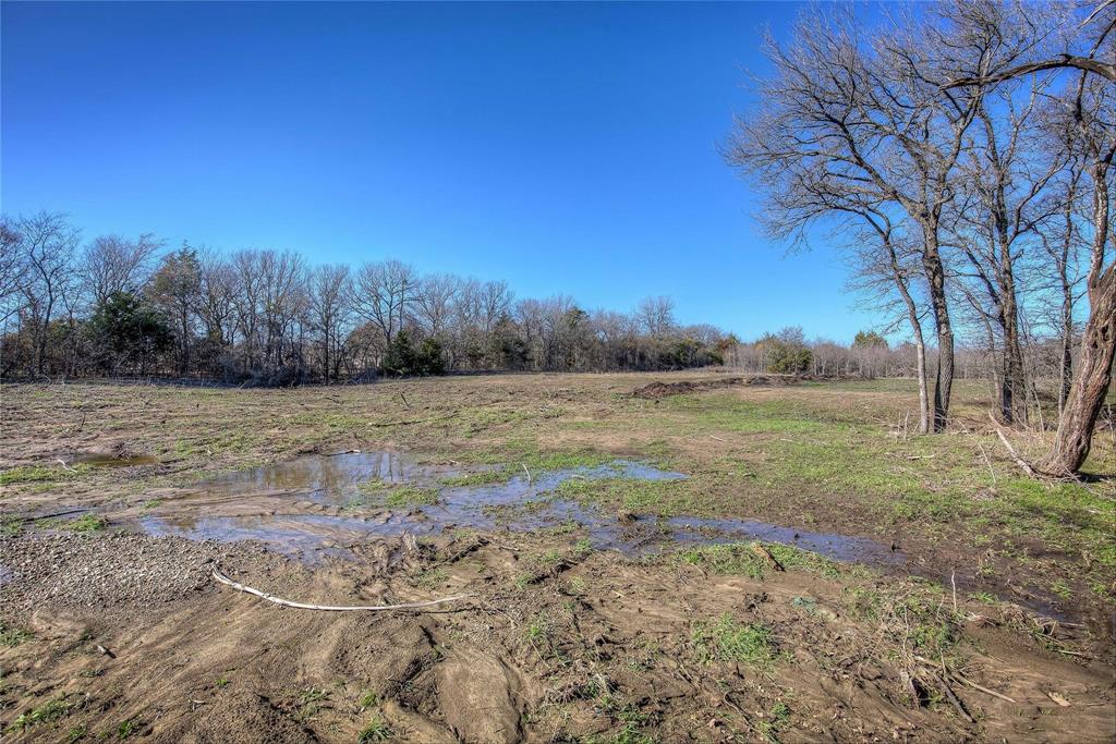 0 West Interstate 30 Campbell, TX 75422 - Photo 23 of 39 a view of a field with trees in the background