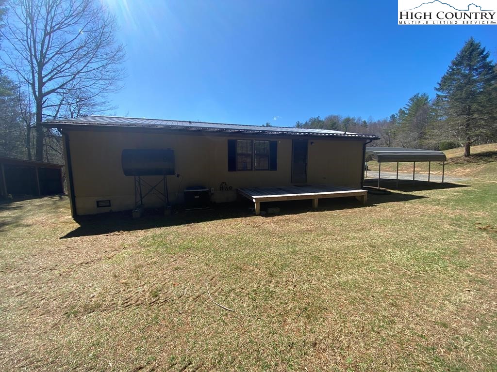 462 Hartsoe Road Warrensville, NC 28693 - Photo 15 of 17 a backyard of a house with lots of green space