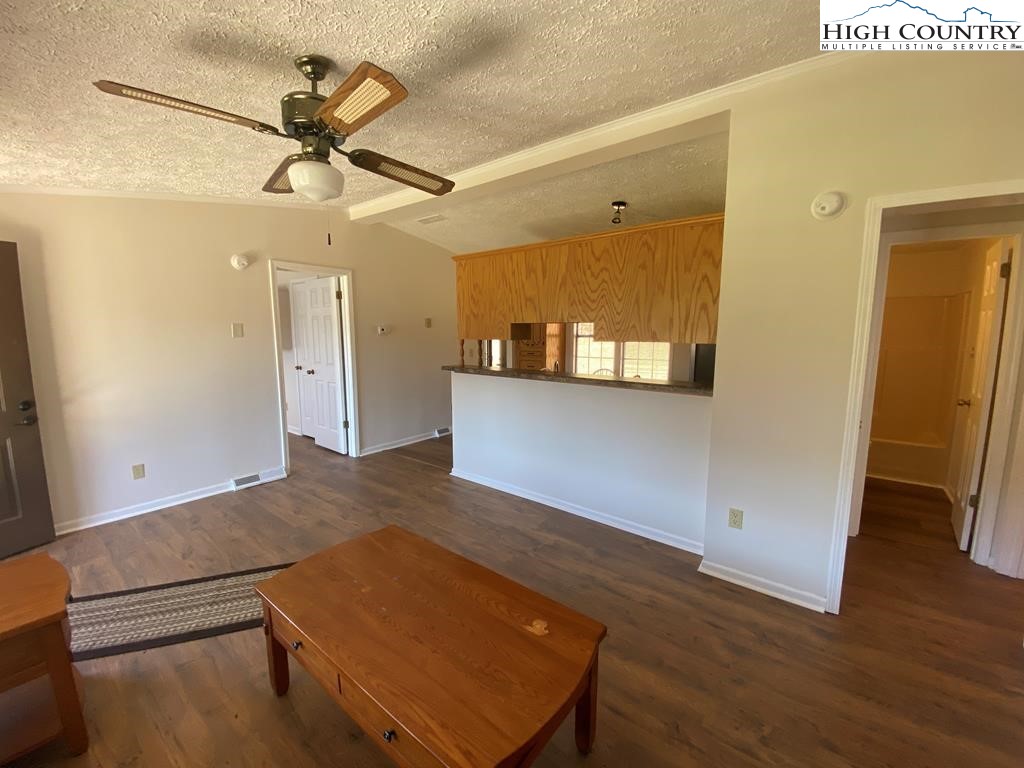 462 Hartsoe Road Warrensville, NC 28693 - Photo 2 of 17 a view of a room with a window and wooden floor