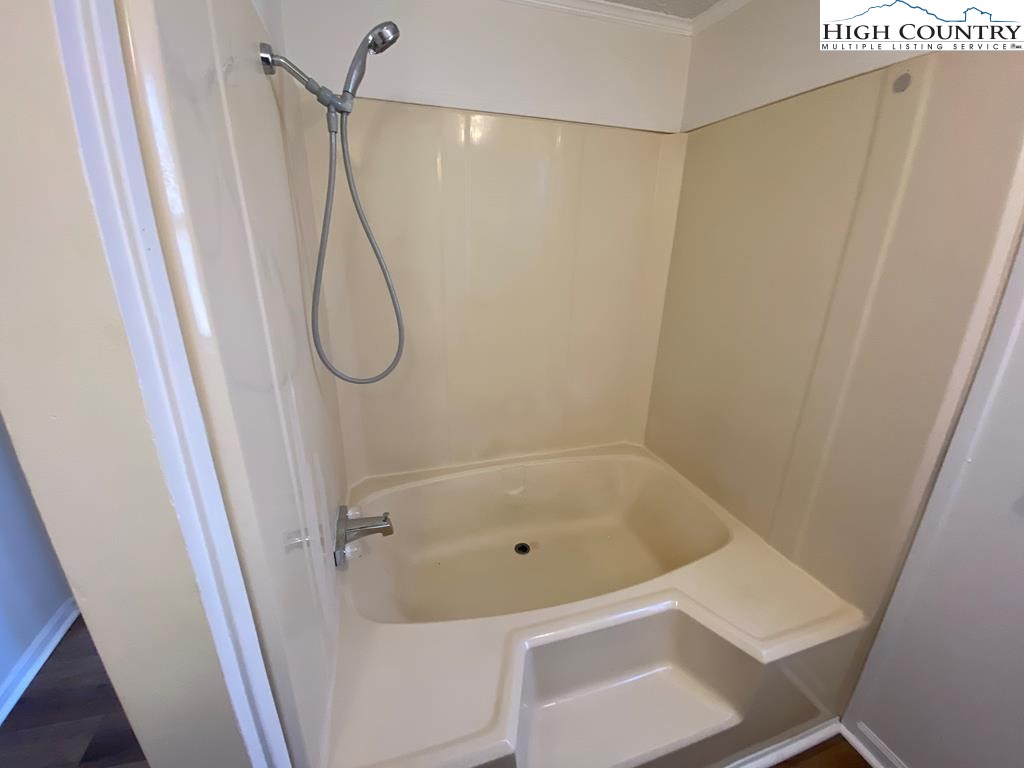 462 Hartsoe Road Warrensville, NC 28693 - Photo 9 of 17 a bathroom with a bath tub