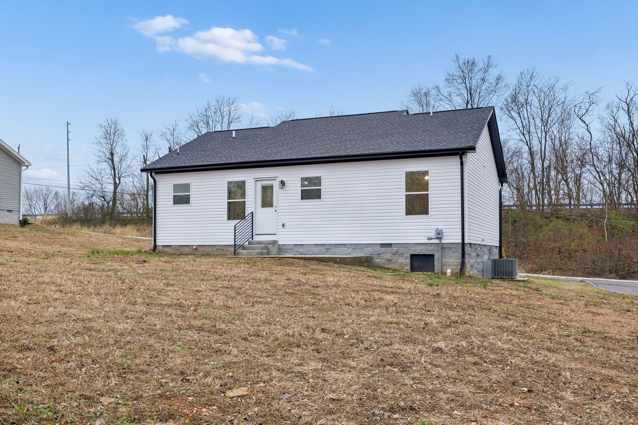 1097 Landing Lane Adams, TN 37010 - Photo 25 of 30 a house view with a backyard space