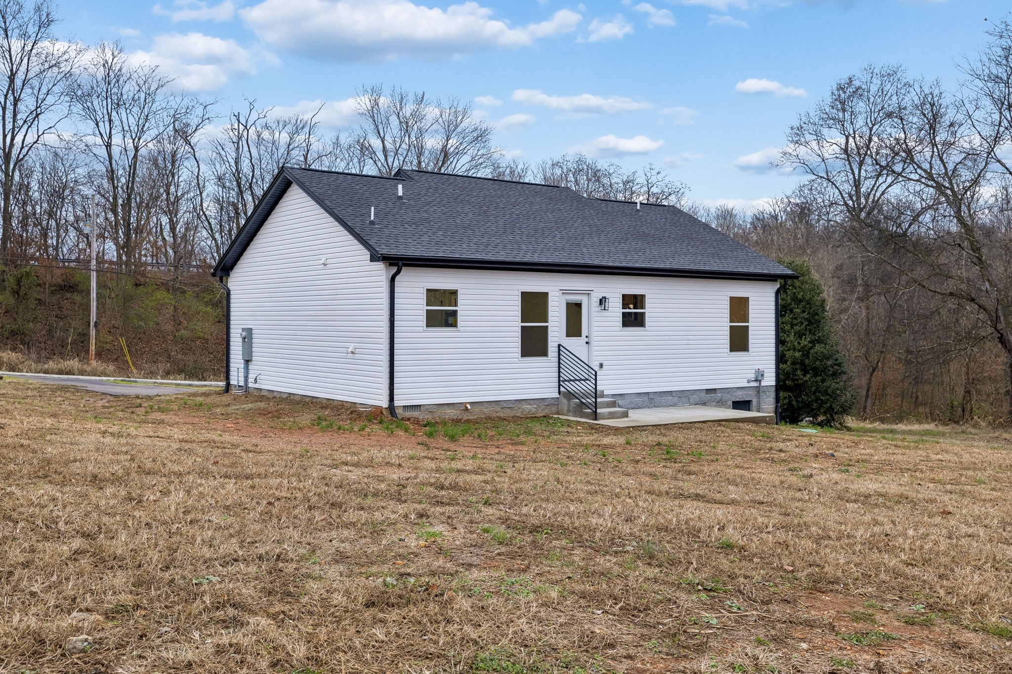 1097 Landing Lane Adams, TN 37010 - Photo 27 of 30 a view of a house with a backyard