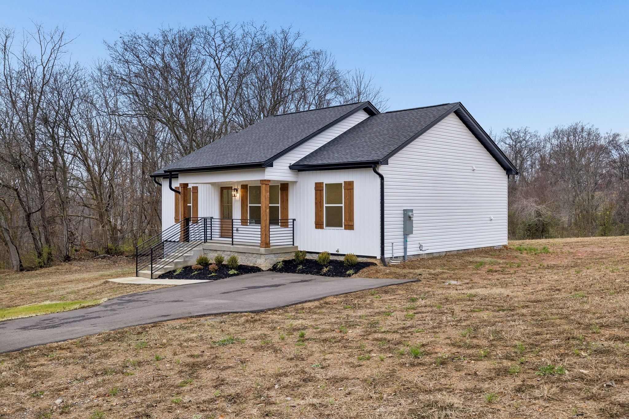 1097 Landing Lane Adams, TN 37010 - Photo 4 of 30 a front view of a house with a yard