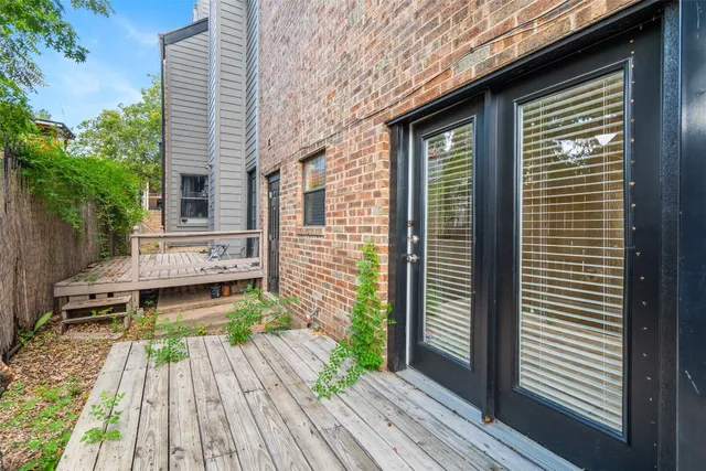 a view of a deck with wooden floor and a yard