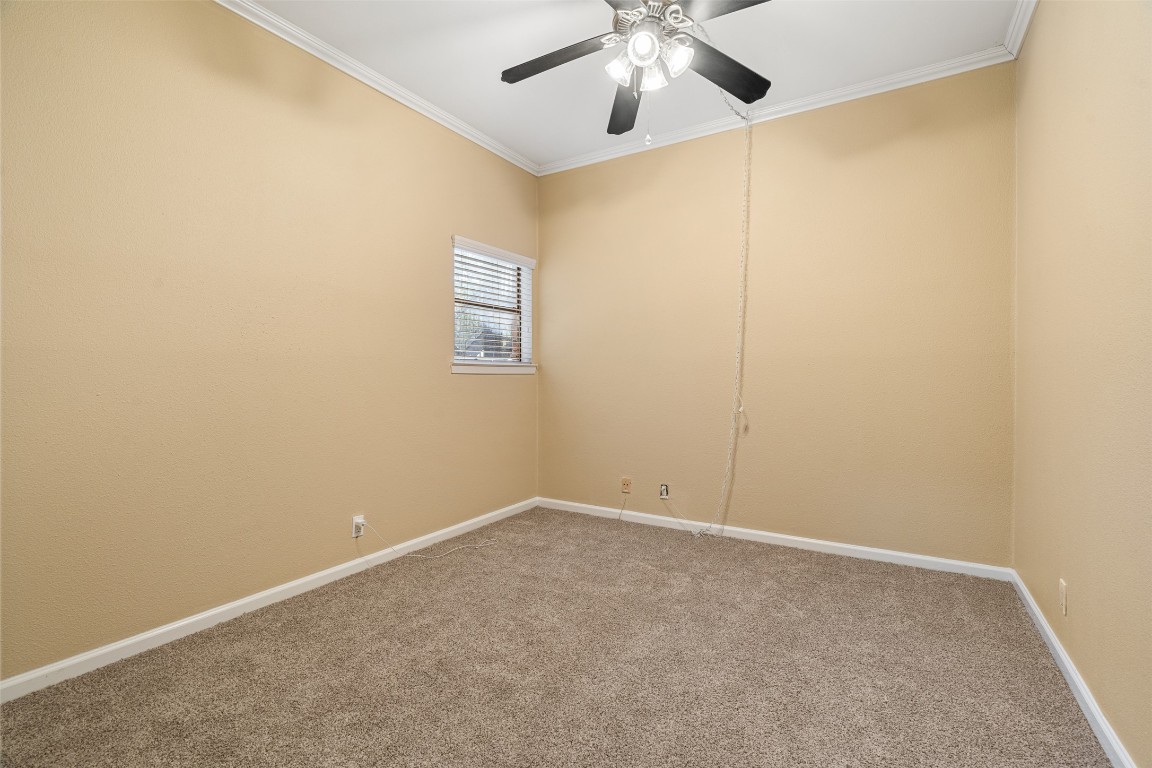 505 Bellevue Place, Unit 3 Austin, TX 78705 - Photo 14 of 23 an empty room with a chandelier fan