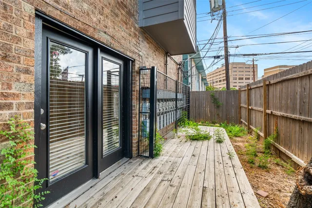 a view of balcony with wooden floor