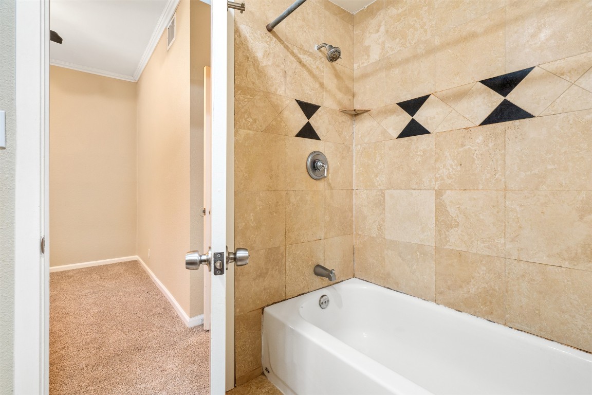 505 Bellevue Place, Unit 3 Austin, TX 78705 - Photo 19 of 23 a white bath tub sitting next to a shower