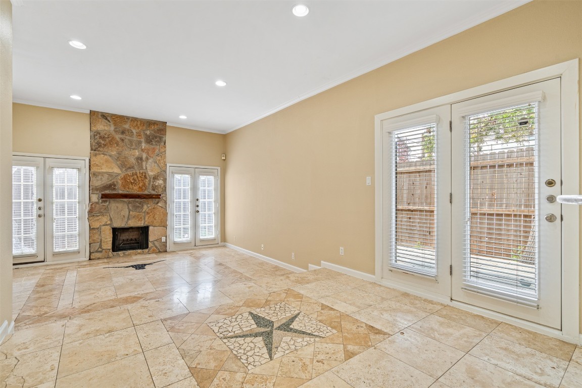 505 Bellevue Place, Unit 3 Austin, TX 78705 - Photo 2 of 23 a view of an empty room with a fireplace and a window