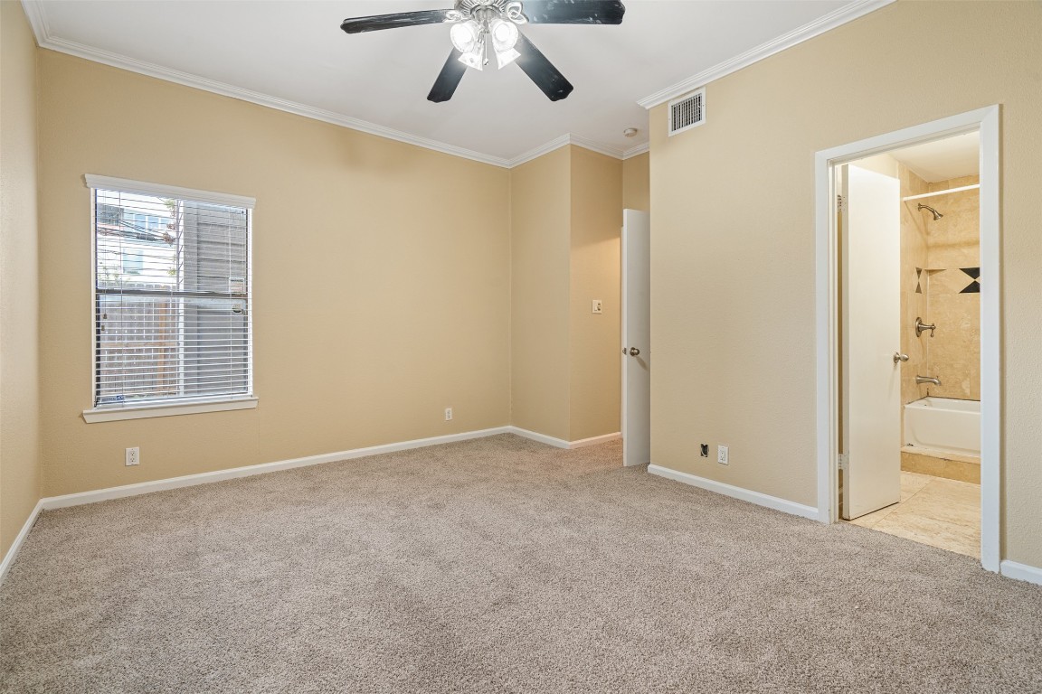 505 Bellevue Place, Unit 3 Austin, TX 78705 - Photo 22 of 23 an empty room with windows and fan