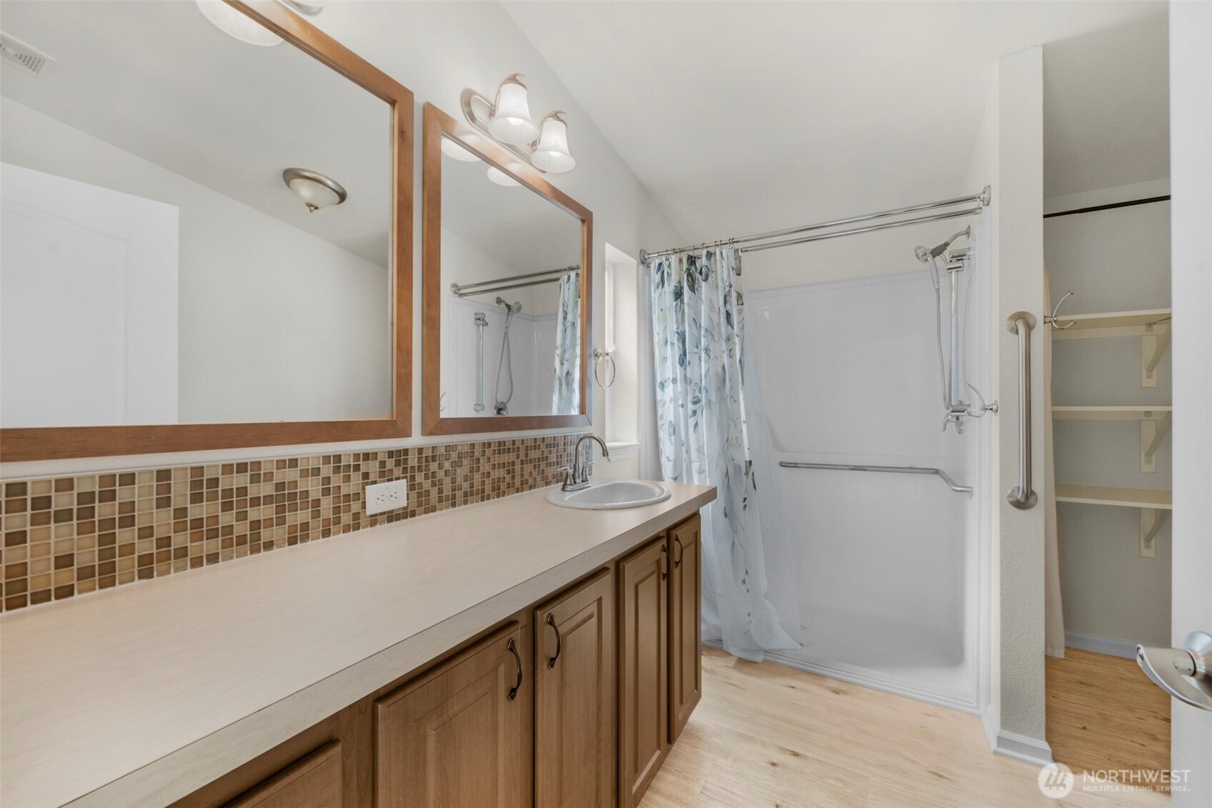 3539 Southwest 100th Street Seattle, WA 98146 - Photo 15 of 32 a bathroom with a sink and a mirror