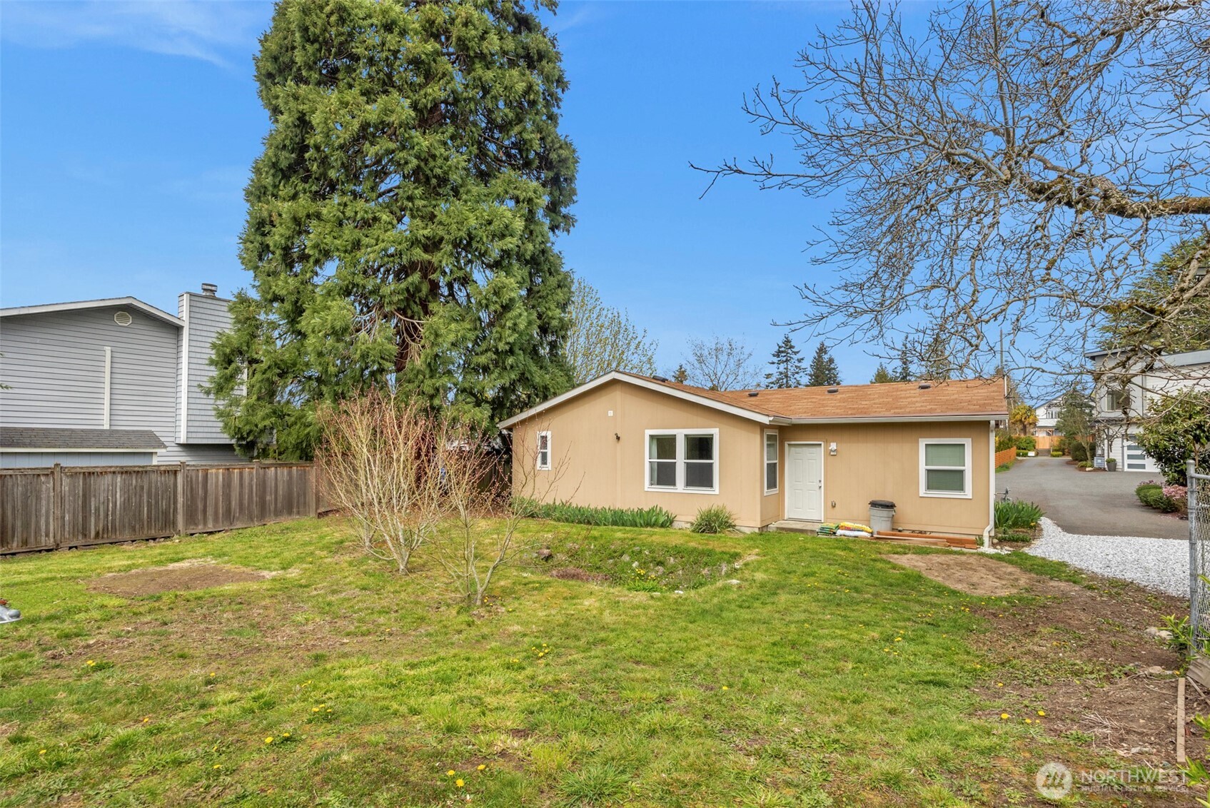 3539 Southwest 100th Street Seattle, WA 98146 - Photo 22 of 32 a house view with a garden space