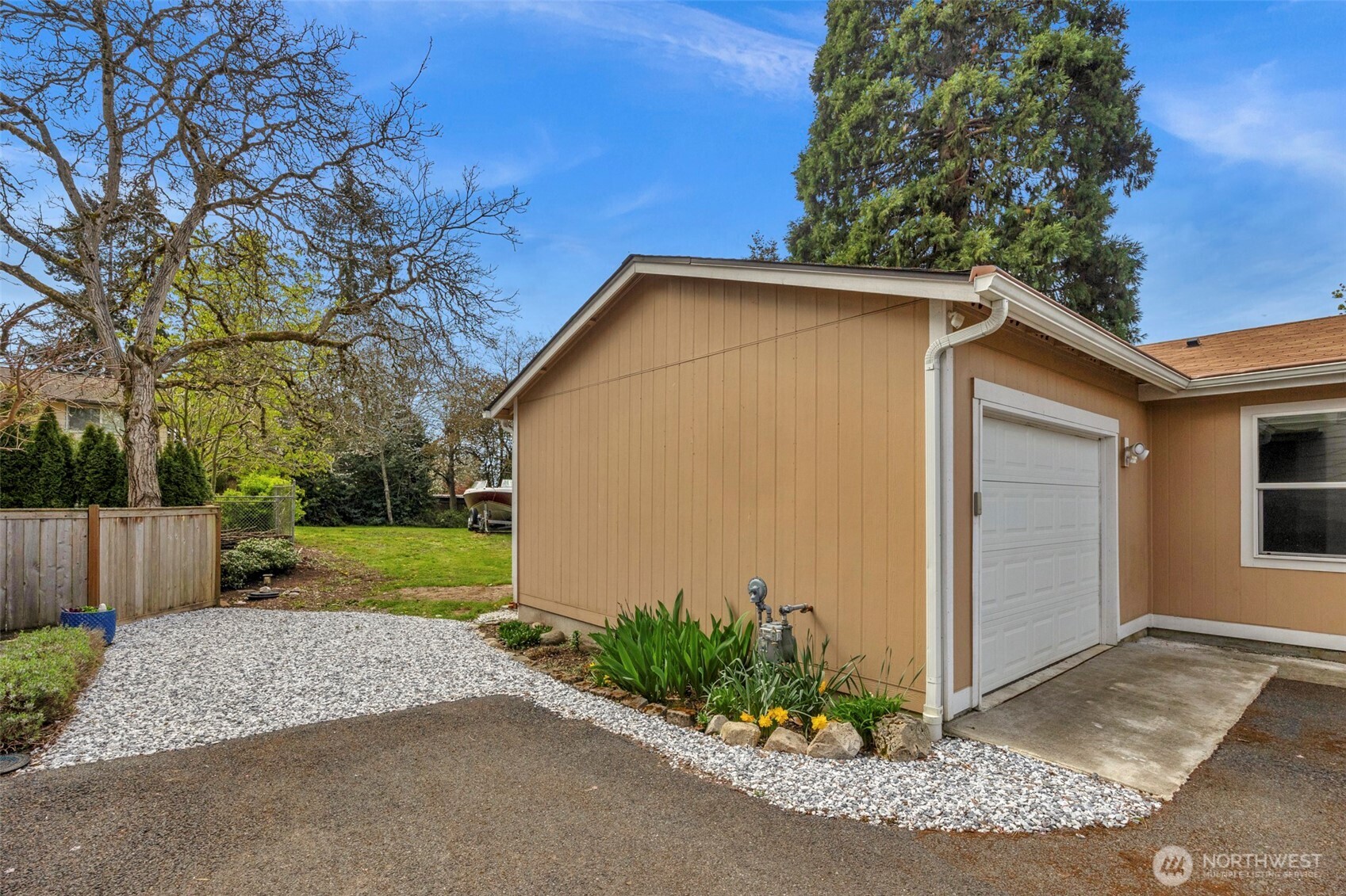3539 Southwest 100th Street Seattle, WA 98146 - Photo 25 of 32 a front view of a house with garden