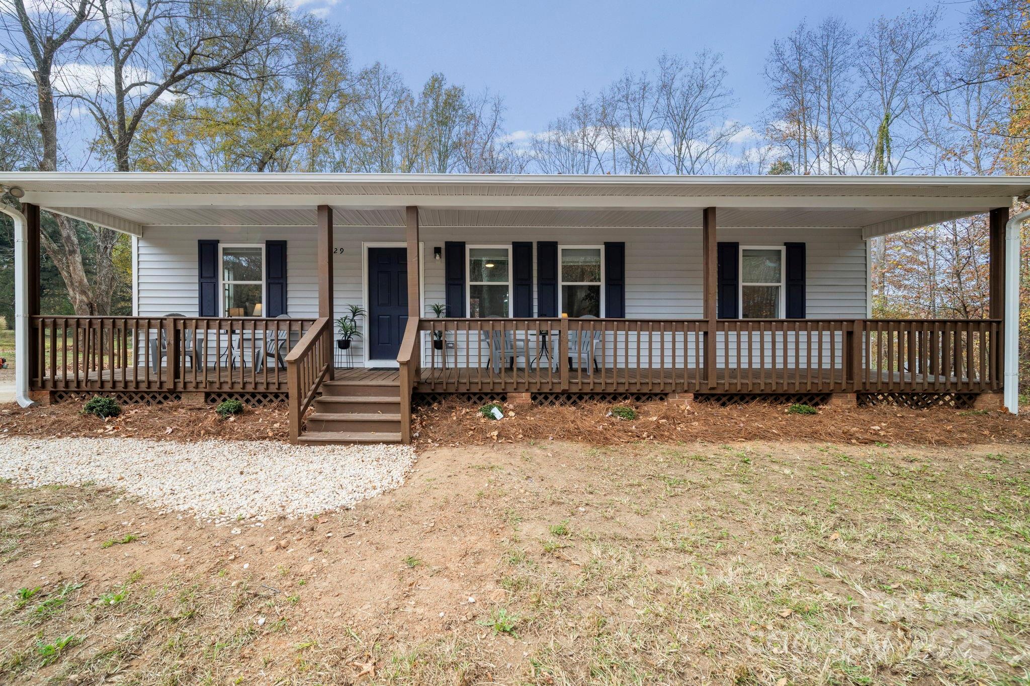 a front view of a house with wooden fence