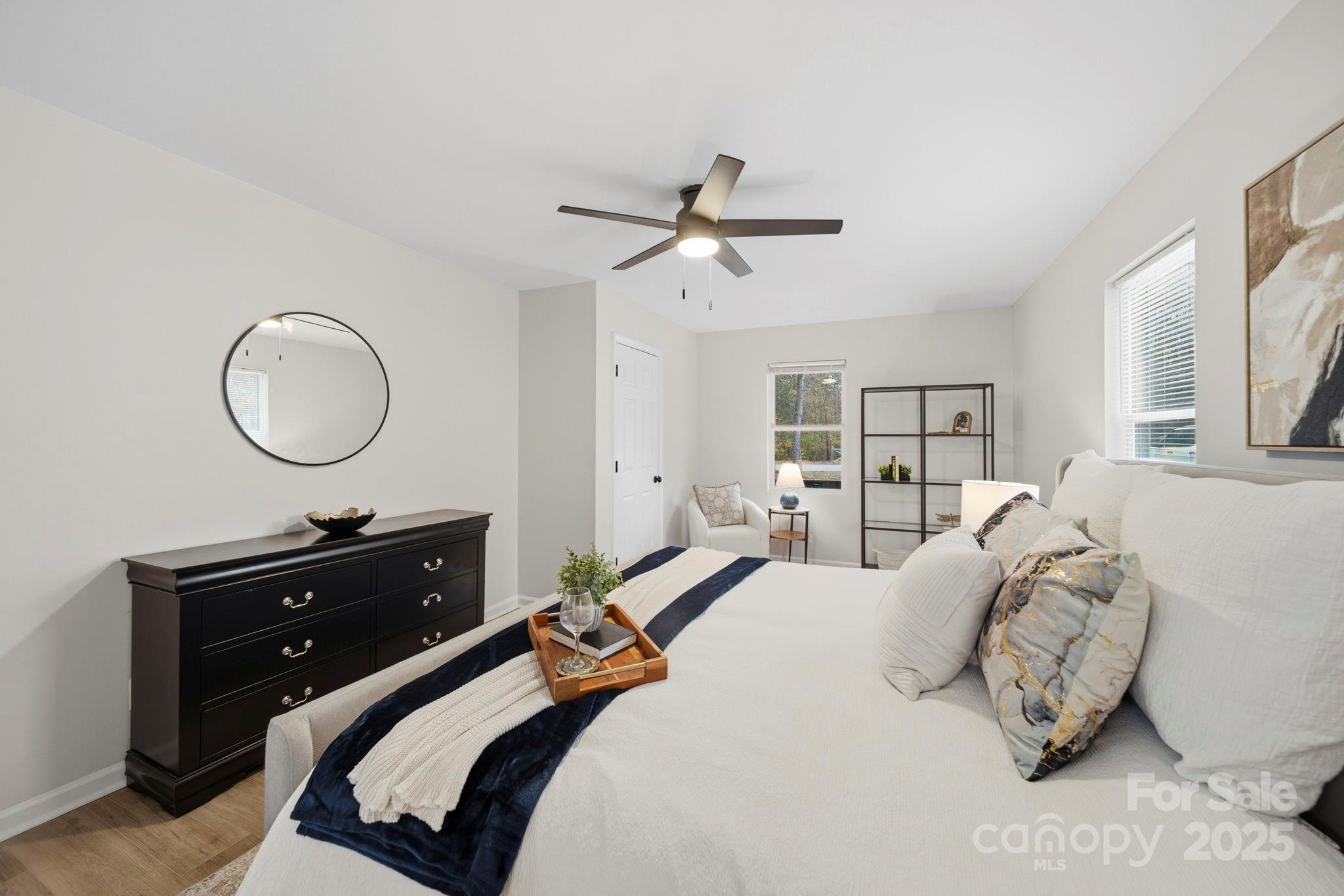 9329 Possum Hollow Road Fort Mill, SC 29707 - Photo 13 of 45 a bedroom with a bed and a mirror