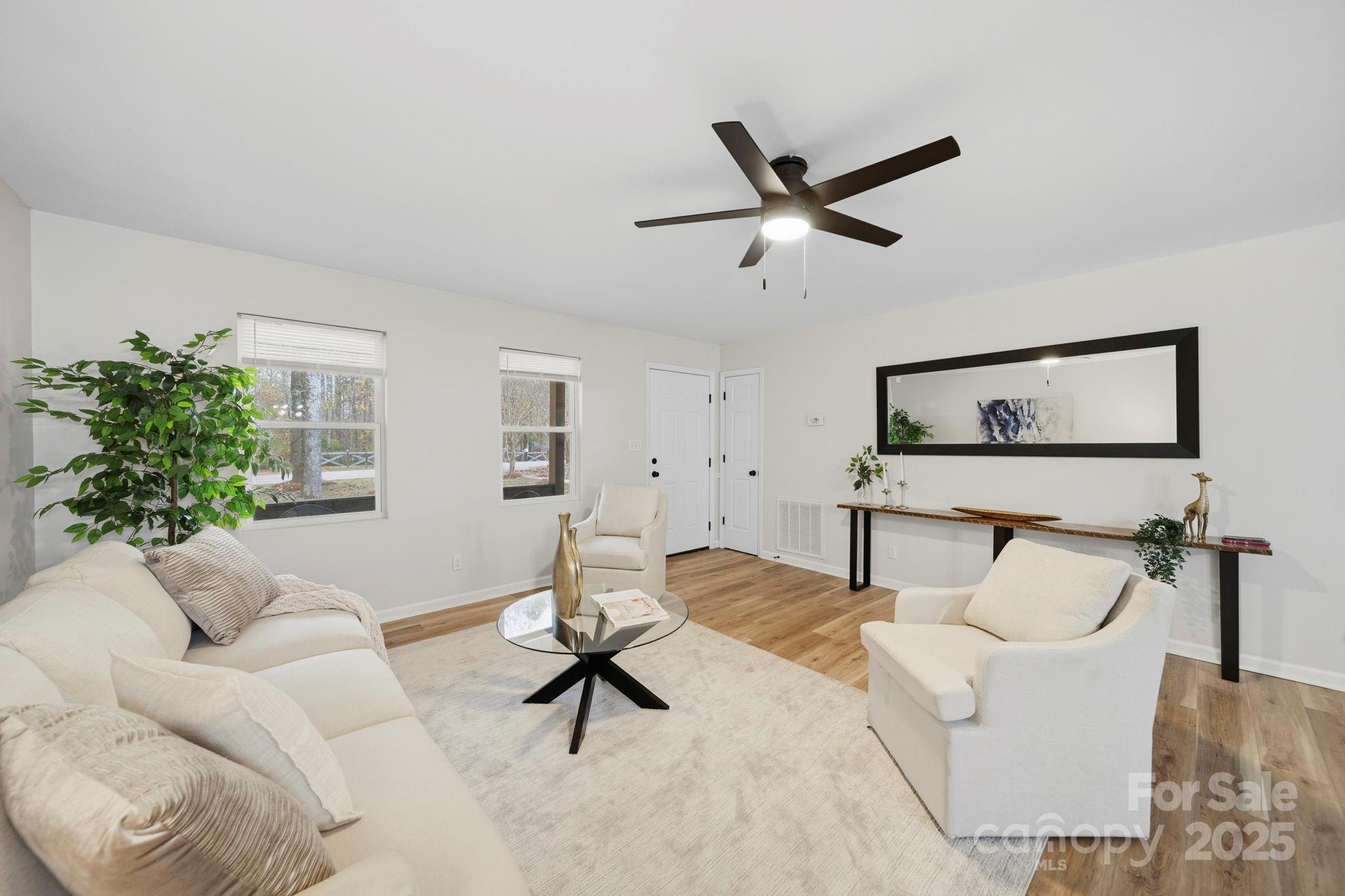 9329 Possum Hollow Road Fort Mill, SC 29707 - Photo 20 of 45 a living room with furniture and a window