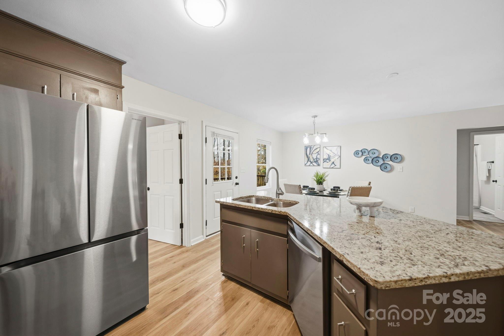 9329 Possum Hollow Road Fort Mill, SC 29707 - Photo 2 of 45 a kitchen with stainless steel appliances granite countertop a sink stove and refrigerator