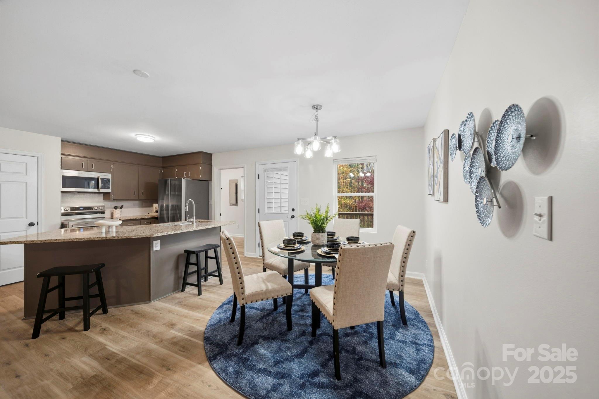 9329 Possum Hollow Road Fort Mill, SC 29707 - Photo 21 of 45 a view of a dining room with furniture