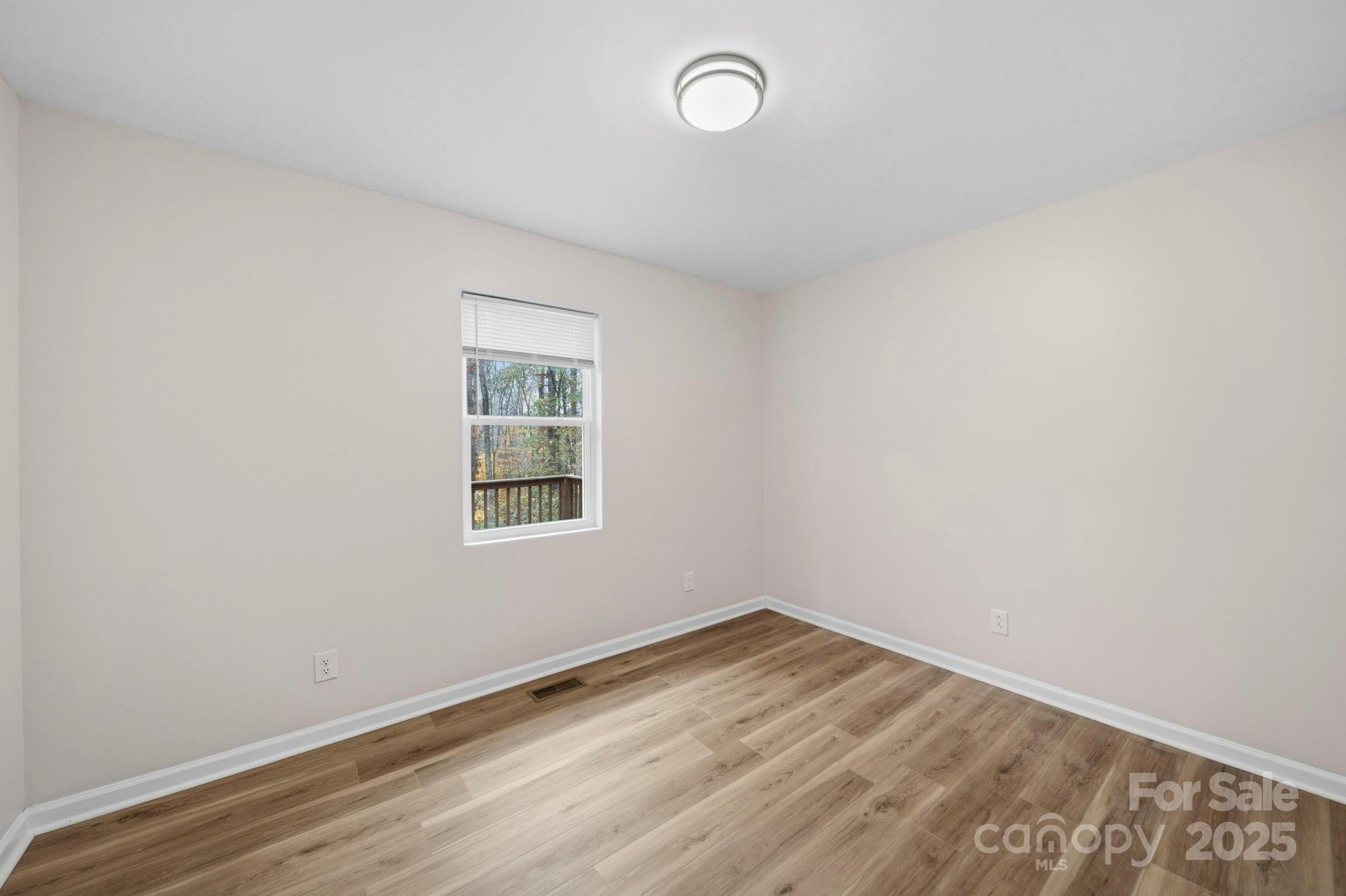 9329 Possum Hollow Road Fort Mill, SC 29707 - Photo 24 of 45 an empty room with a window