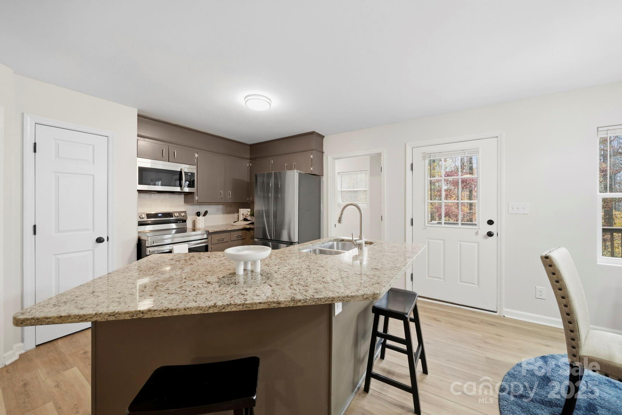 9329 Possum Hollow Road Fort Mill, SC 29707 - Photo 27 of 45 a view of kitchen and dining area with furniture