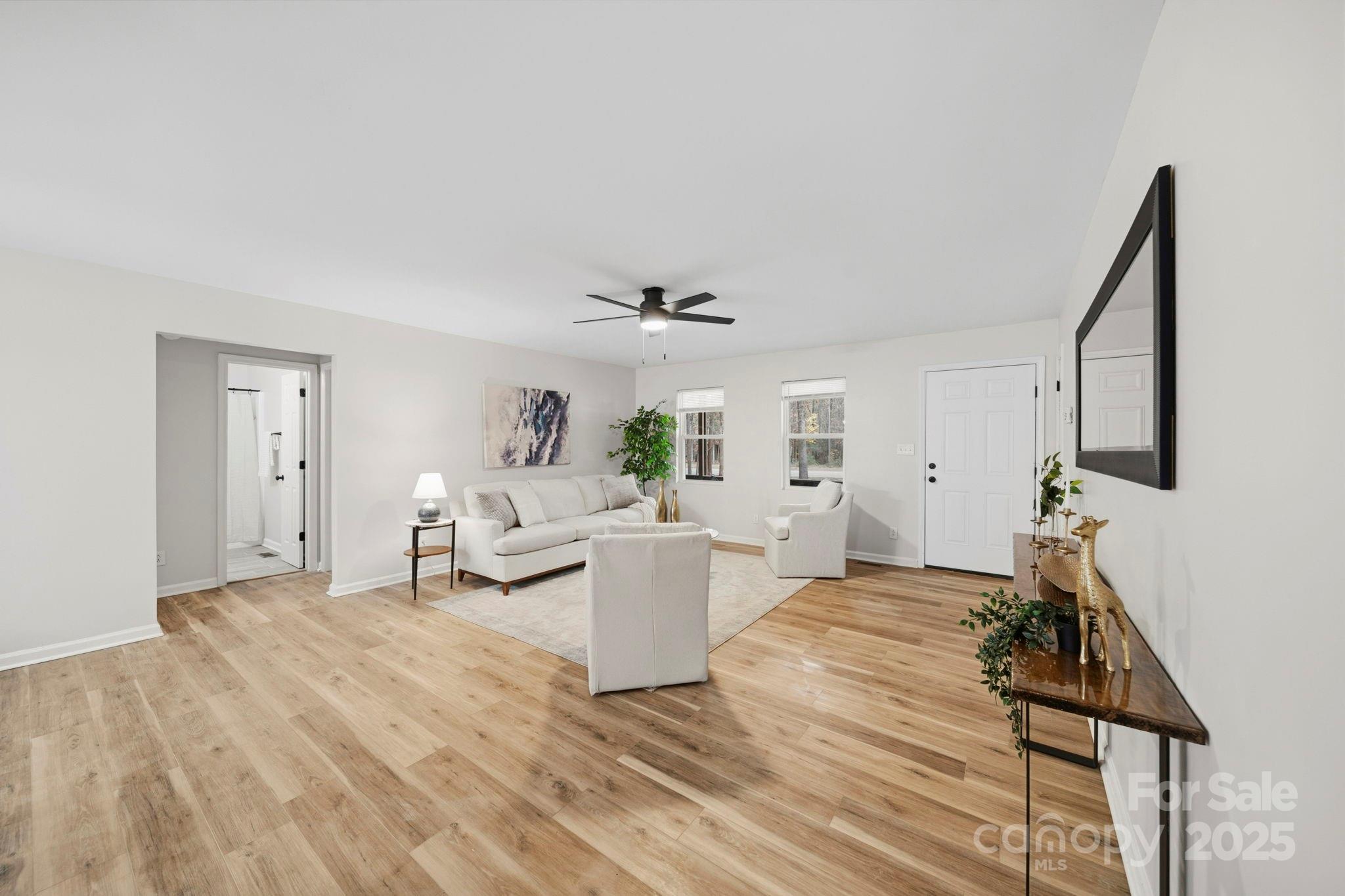 9329 Possum Hollow Road Fort Mill, SC 29707 - Photo 30 of 45 a living room with furniture and a wooden floor