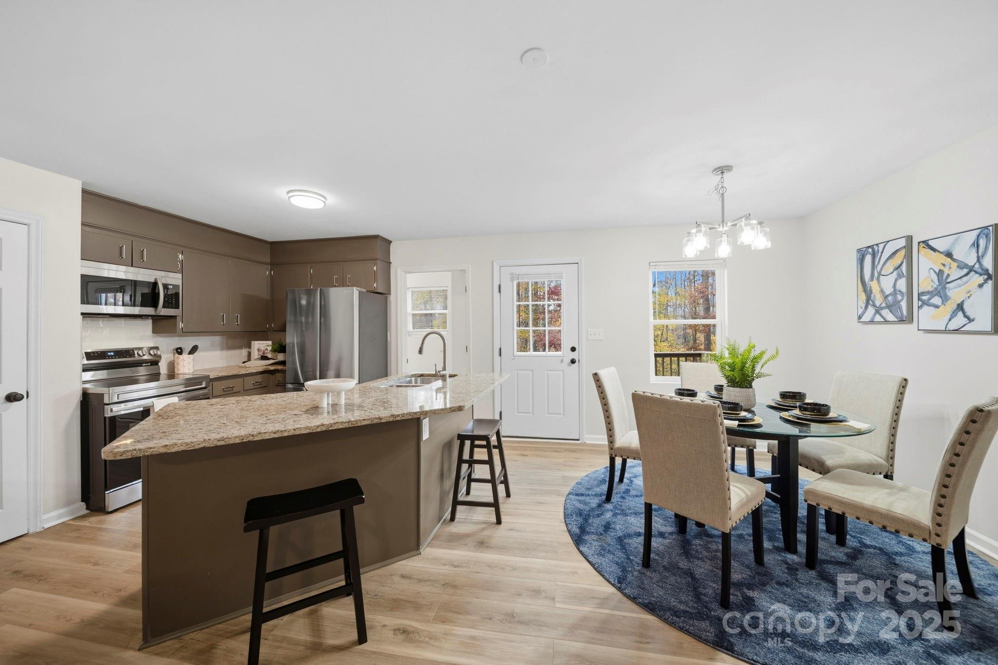 9329 Possum Hollow Road Fort Mill, SC 29707 - Photo 32 of 45 a view of a dining room with furniture