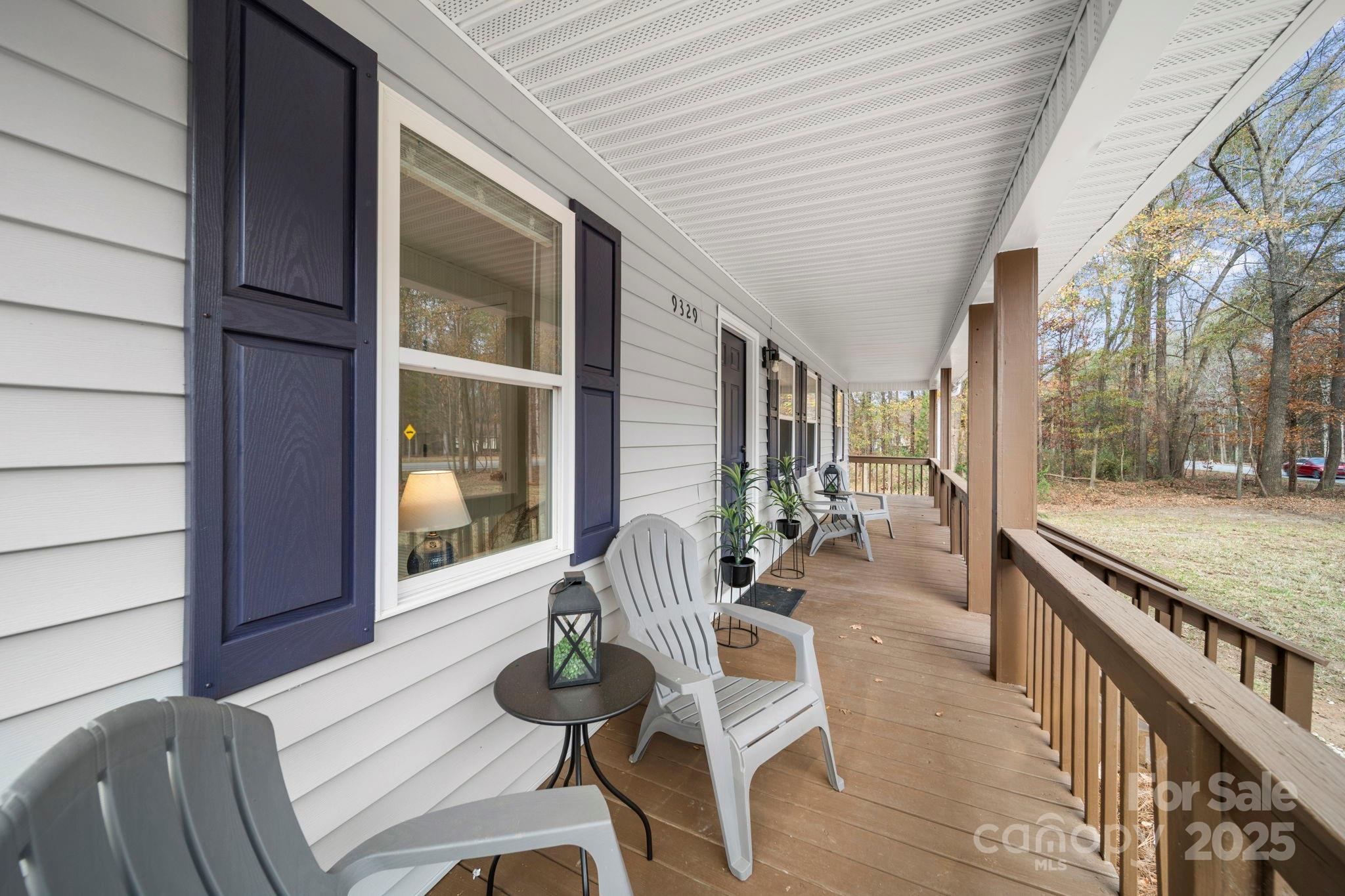 9329 Possum Hollow Road Fort Mill, SC 29707 - Photo 33 of 45 a balcony with furniture and wooden floor