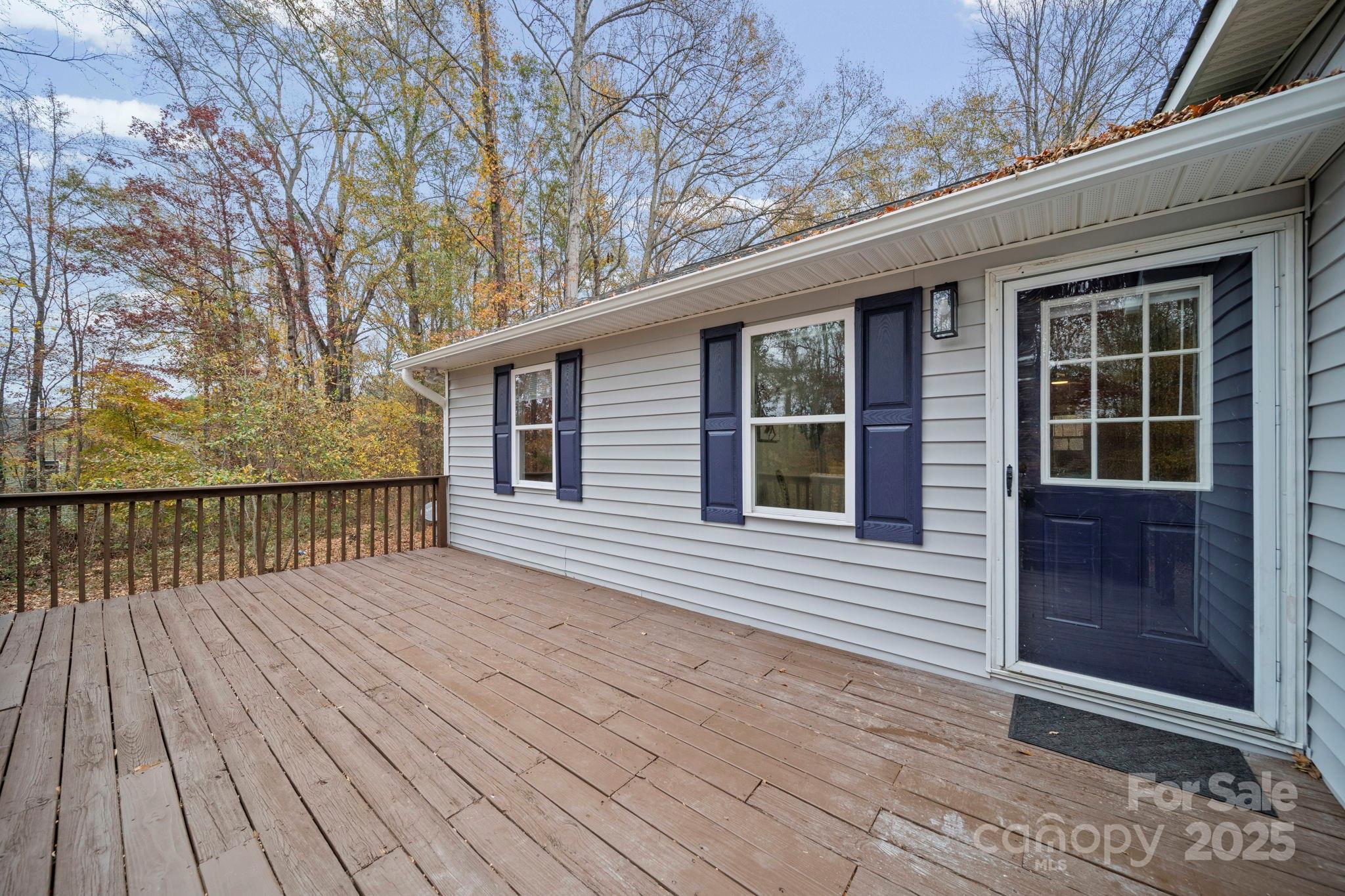 9329 Possum Hollow Road Fort Mill, SC 29707 - Photo 37 of 45 a view of backyard with deck and wooden floor