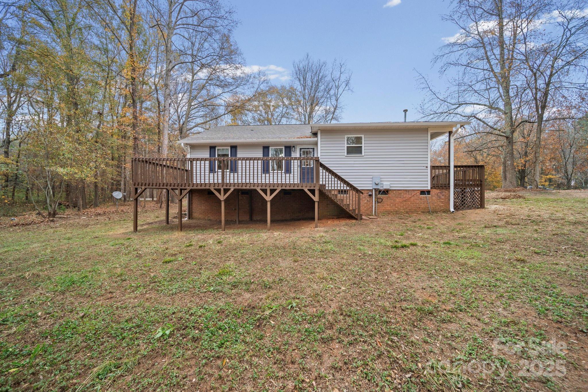 9329 Possum Hollow Road Fort Mill, SC 29707 - Photo 39 of 45 a view of a house with a yard
