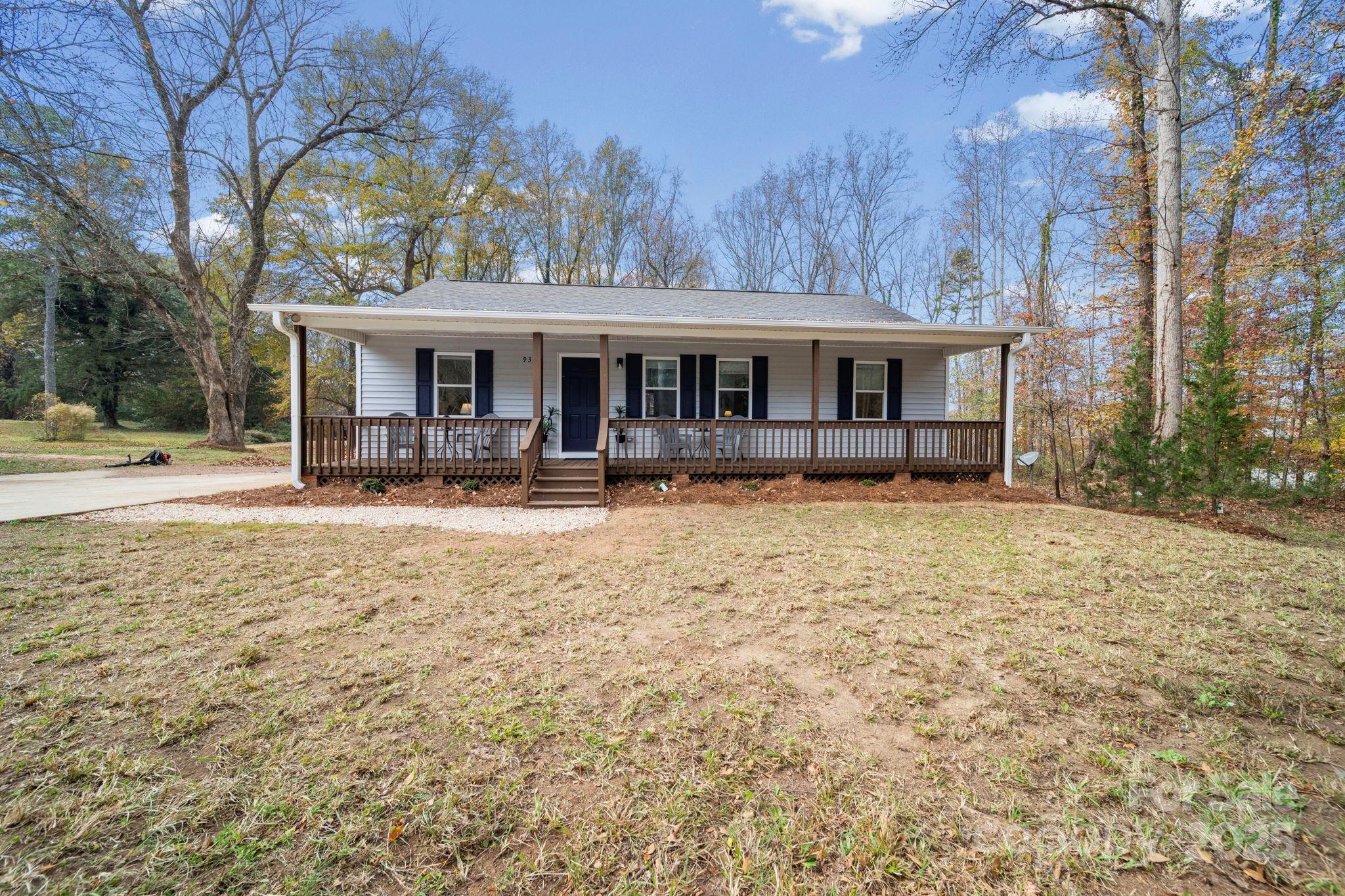 9329 Possum Hollow Road Fort Mill, SC 29707 - Photo 41 of 45 a front view of house with yard and trees in the background