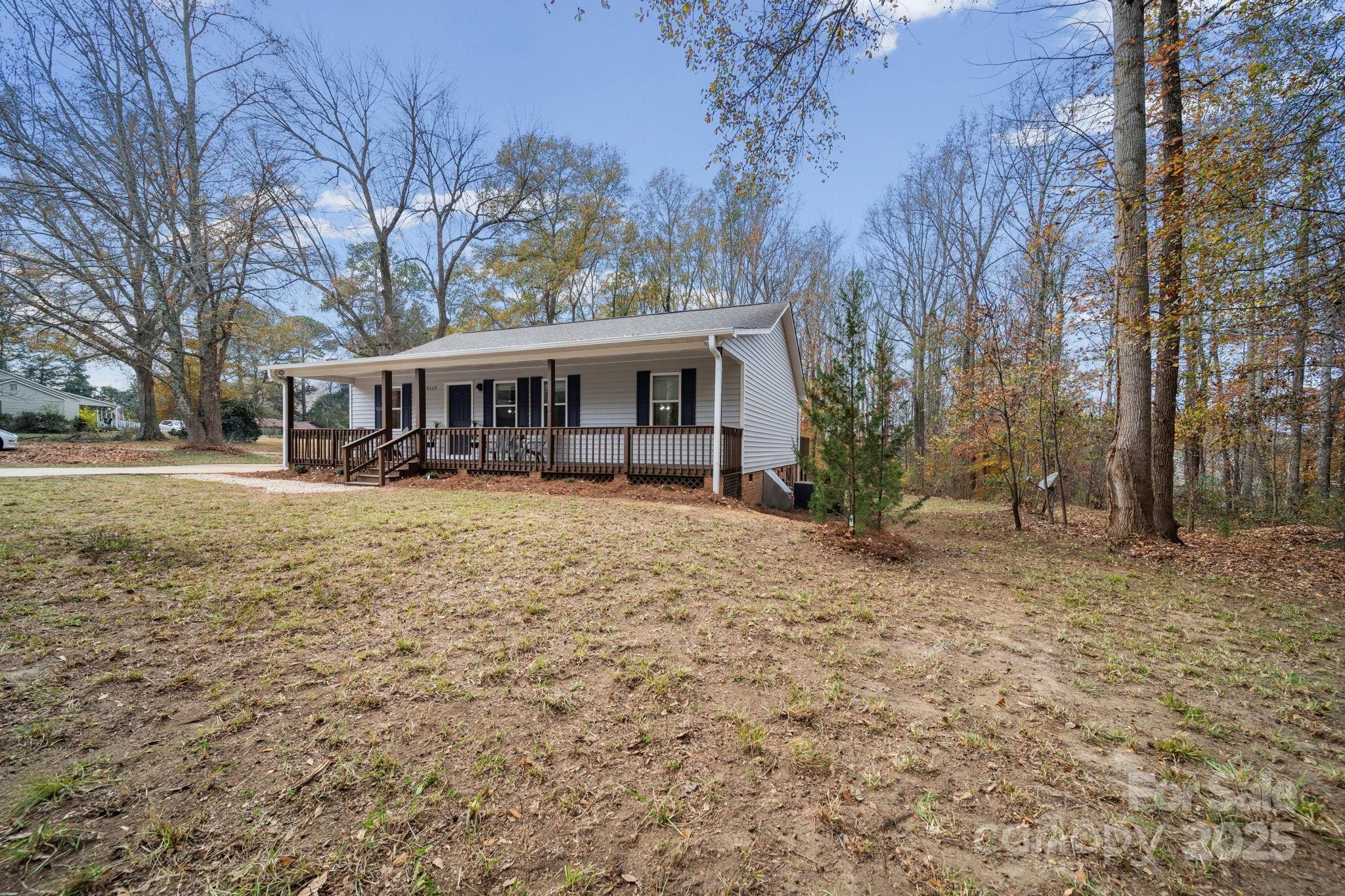 9329 Possum Hollow Road Fort Mill, SC 29707 - Photo 43 of 45 front view of a house with a yard