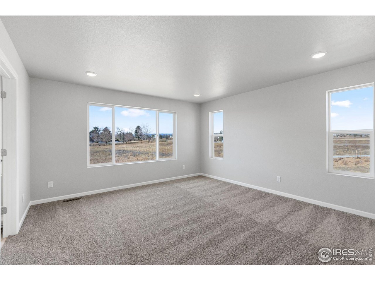 16953 Ballinger Circle Mead, CO 80542 - Photo 12 of 27 a view of an empty room with a window