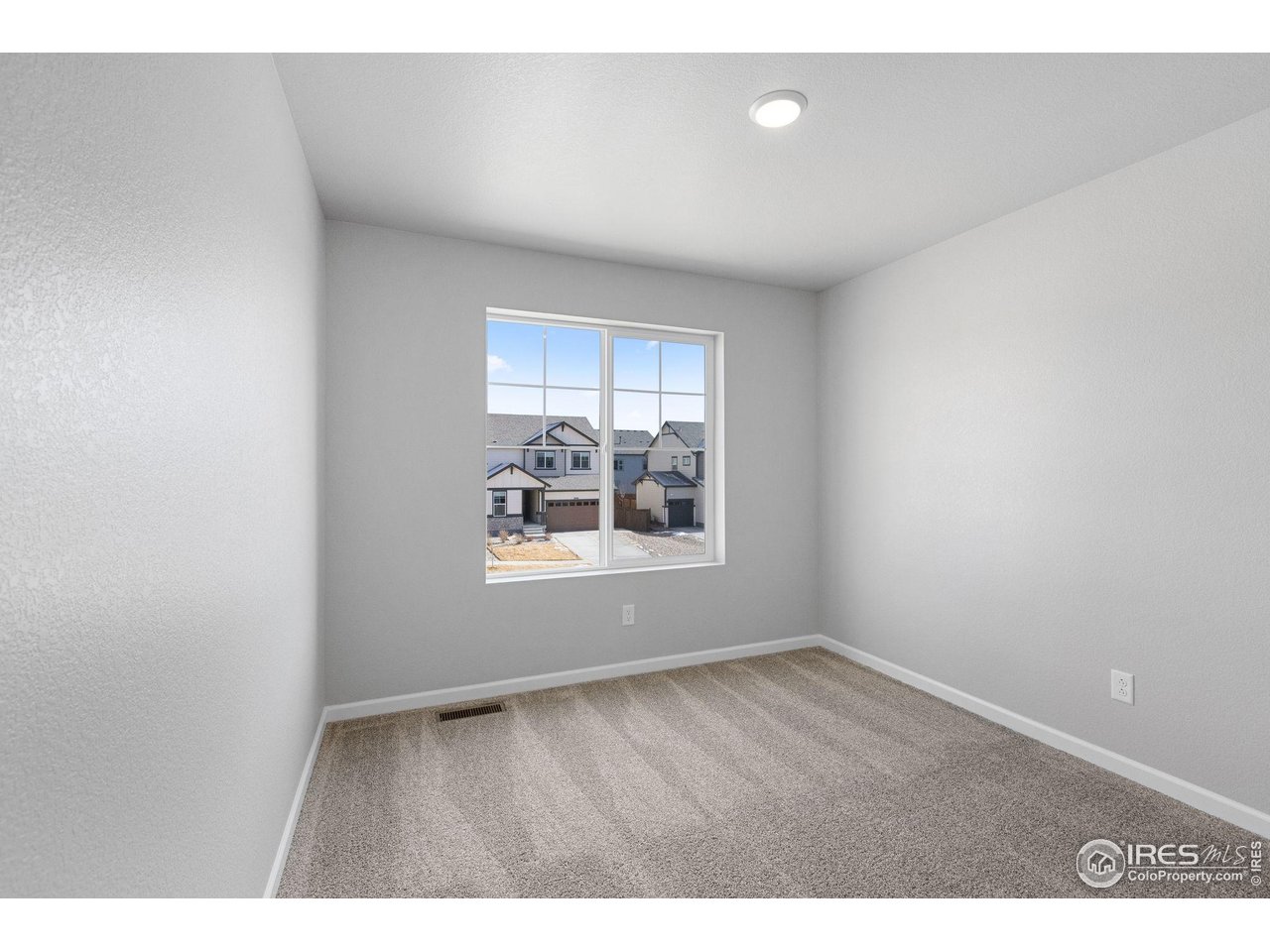 16953 Ballinger Circle Mead, CO 80542 - Photo 19 of 27 a view of an empty room with a window