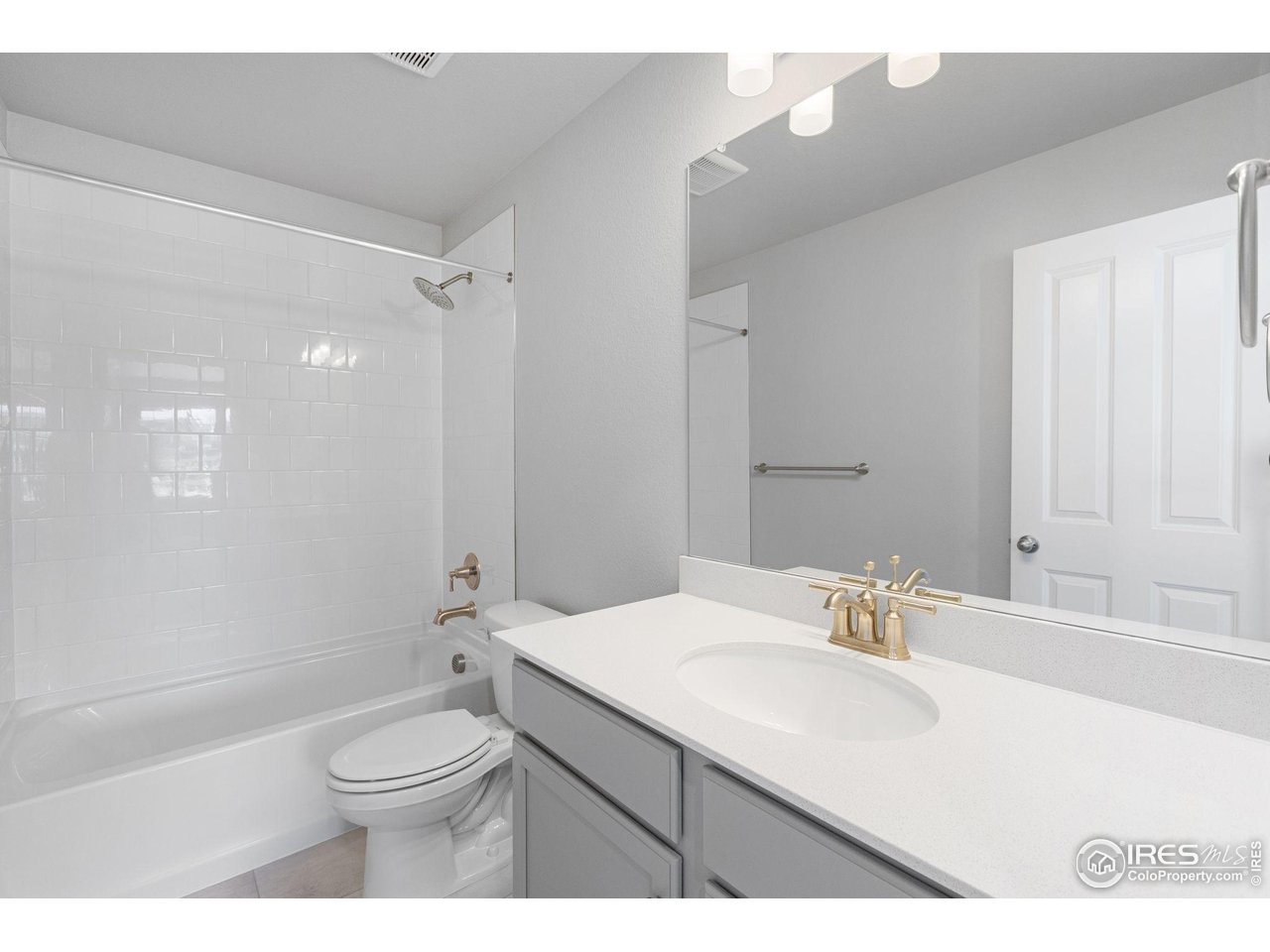 16953 Ballinger Circle Mead, CO 80542 - Photo 21 of 27 a bathroom with a sink a toilet and shower