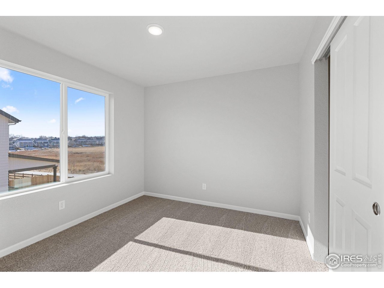 16953 Ballinger Circle Mead, CO 80542 - Photo 22 of 27 a view of an empty room with a window