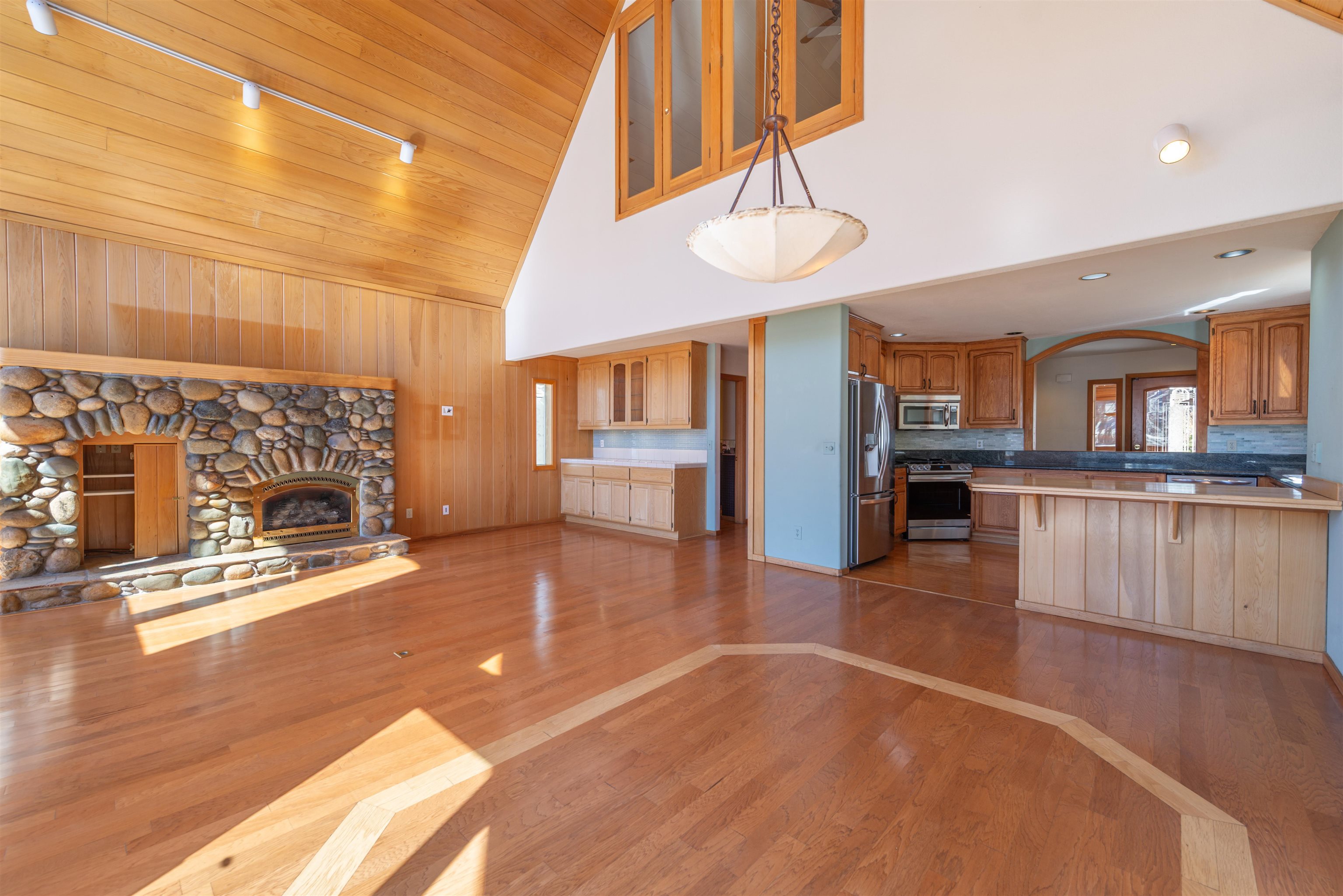13751 Donner Pass Road Truckee, CA 96161 - Photo 16 of 28 a view of a living room and kitchen with furniture wooden floor and a fireplace