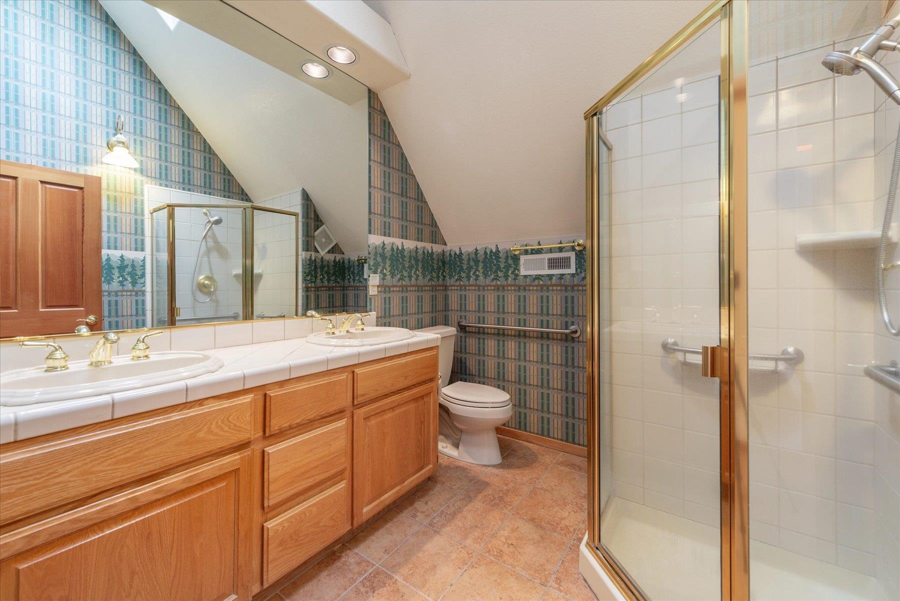 13751 Donner Pass Road Truckee, CA 96161 - Photo 20 of 28 a bathroom with a toilet sink and shower