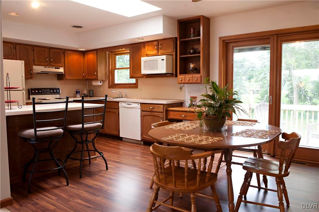214 Ruth Road Bath, PA 18014 - Photo 9 of 25 a dining table chairs and a kitchen view