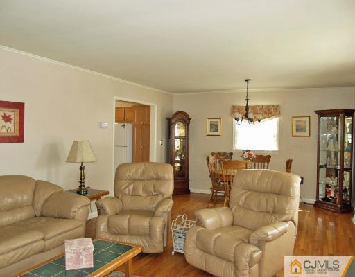 125 Normandy Road Colonia, NJ 07067 - Photo 2 of 10 a living room with furniture and wooden floor