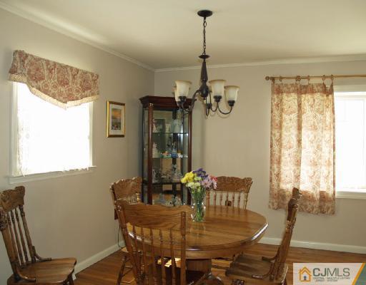 125 Normandy Road Colonia, NJ 07067 - Photo 3 of 10 a view of a dining room with furniture window and outside view