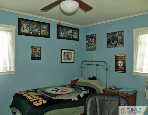 125 Normandy Road Colonia, NJ 07067 - Photo 6 of 10 a bedroom with a bed and furniture