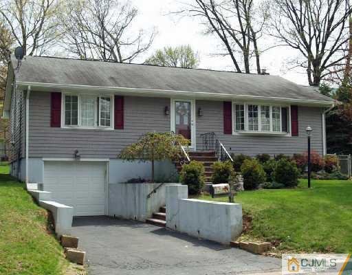 125 Normandy Road Colonia, NJ 07067 - Photo 10 of 10 a front view of a house with a yard