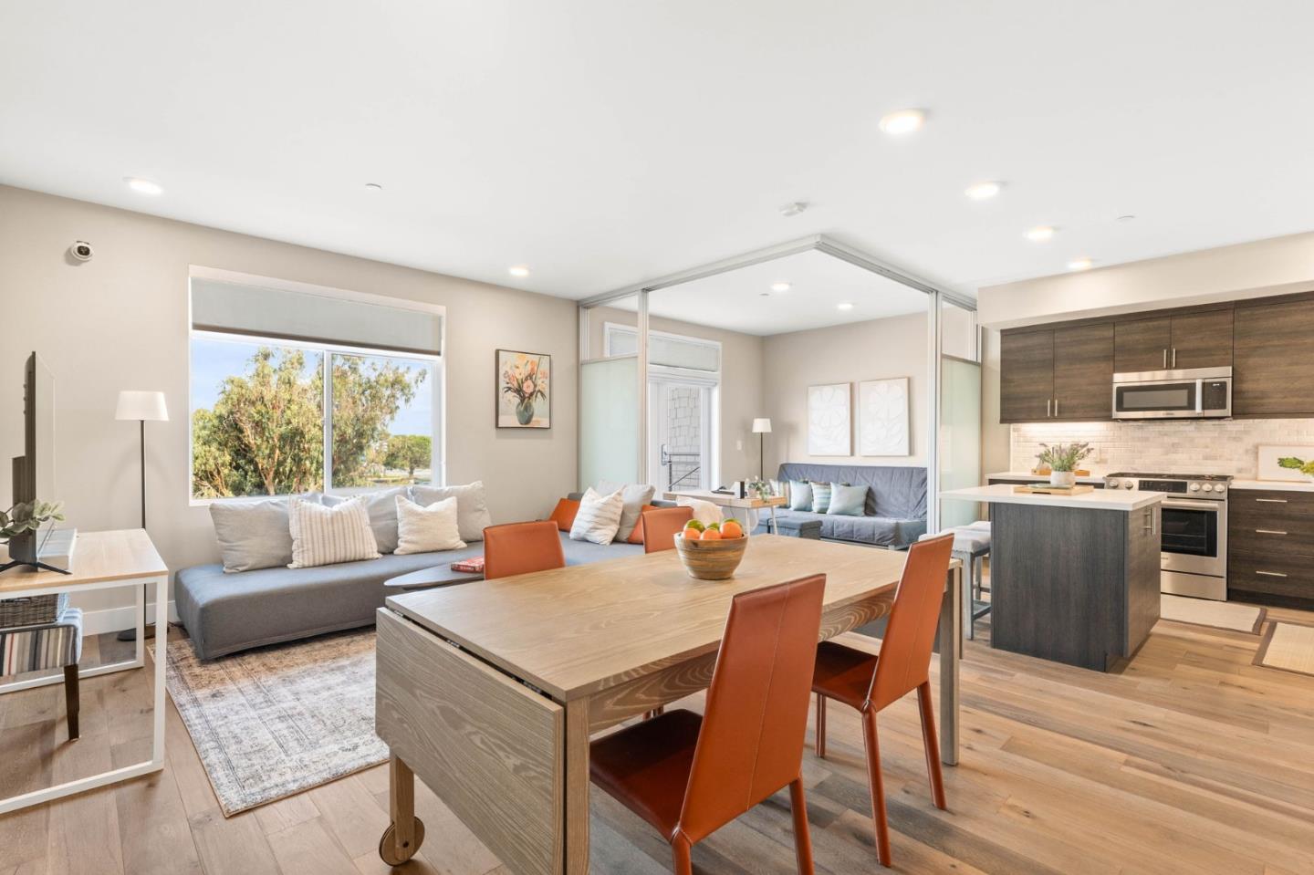400 Mariners Island Boulevard, Unit 202 San Mateo, CA 94404 - Photo 1 of 31 a view of a dining room with furniture window and wooden floor
