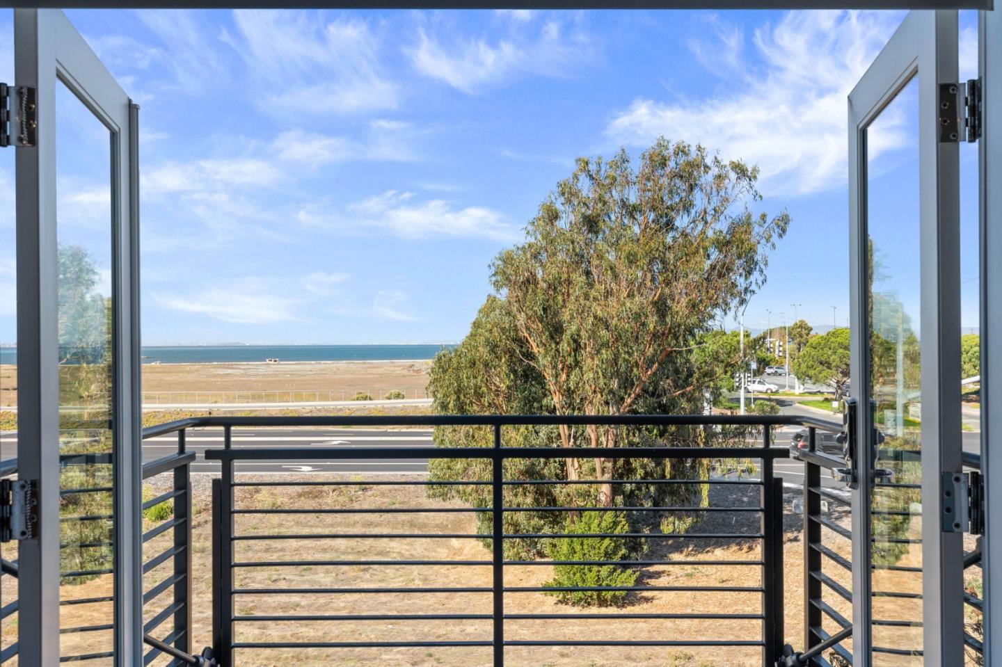 400 Mariners Island Boulevard, Unit 202 San Mateo, CA 94404 - Photo 14 of 31 a view of a balcony next to a yard