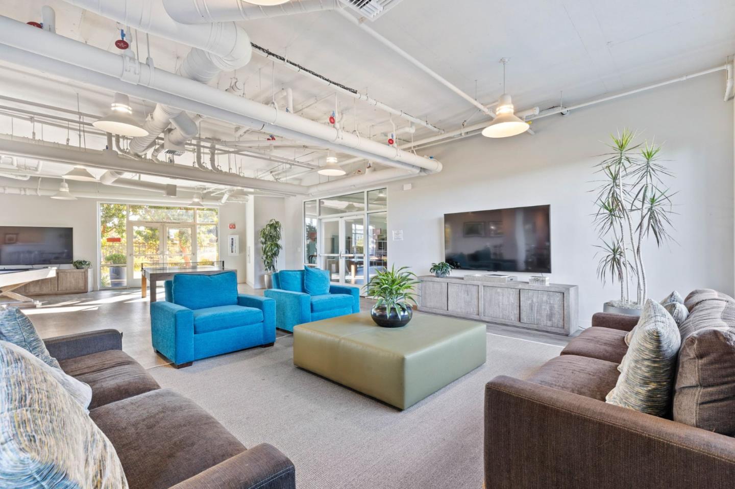 400 Mariners Island Boulevard, Unit 202 San Mateo, CA 94404 - Photo 22 of 31 a living room with furniture and a flat screen tv