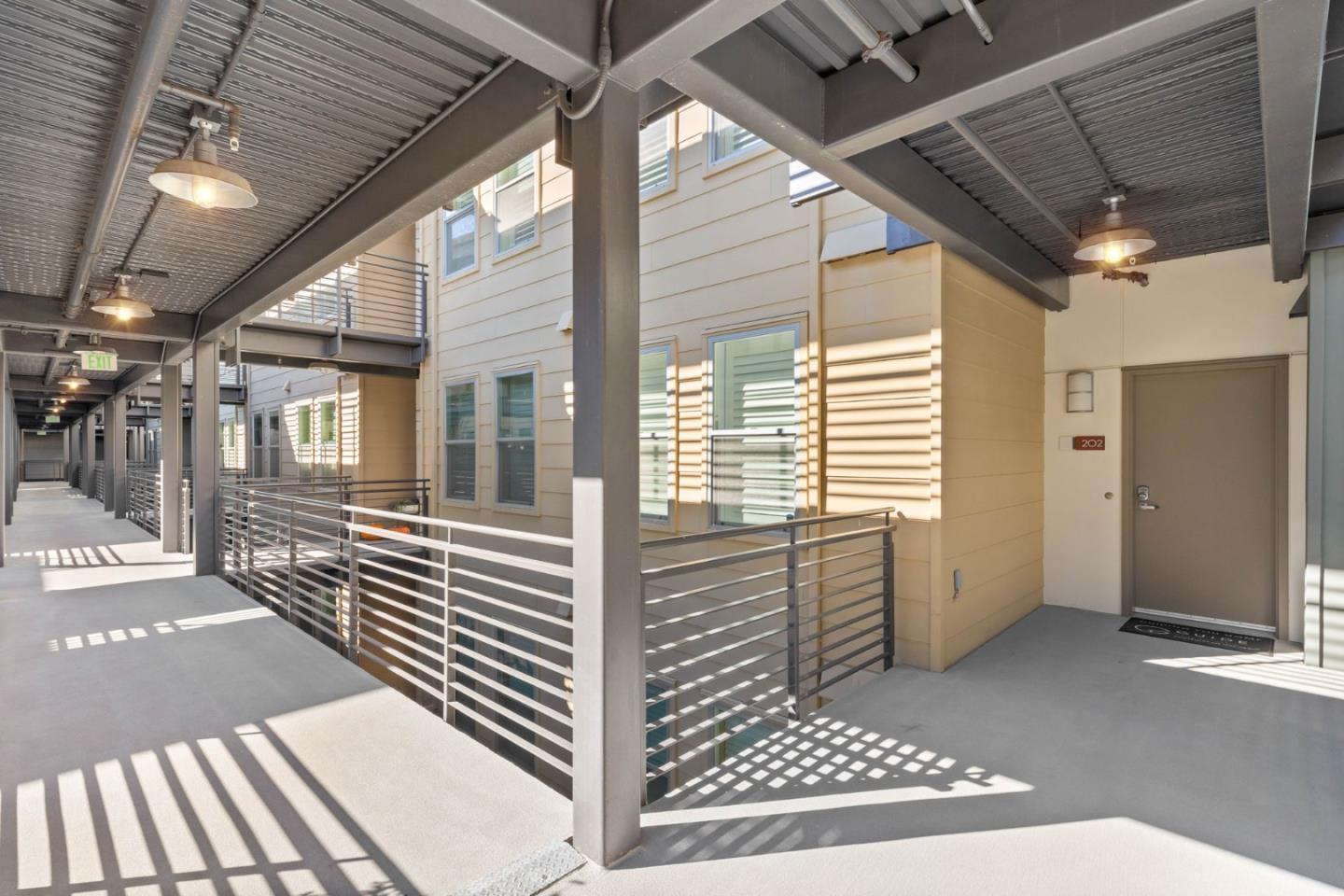400 Mariners Island Boulevard, Unit 202 San Mateo, CA 94404 - Photo 29 of 31 a view of a porch with wooden floor and iron stairs